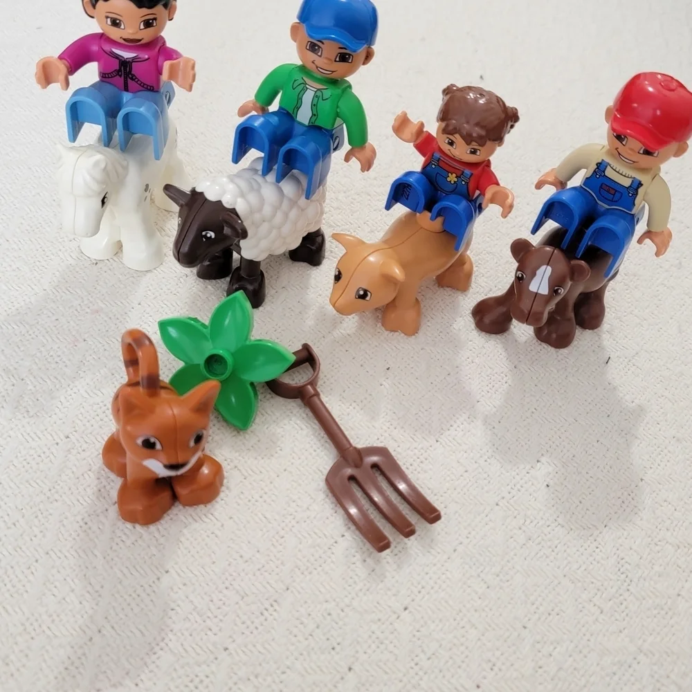 Lego Farmers set with 10 figures, including a farmer, farmer's wife, and 2 kids,